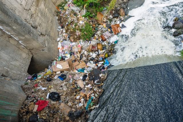 massive amount of waste under bridge