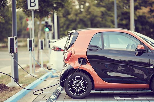 electric car charging at a charging station