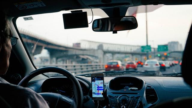 man sitting in a self driving car