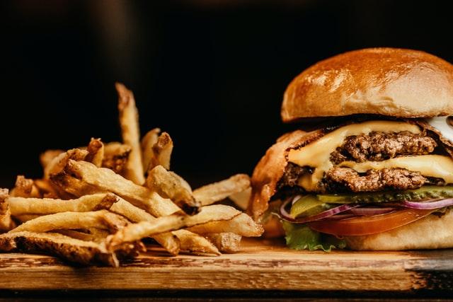 delicious juicy hamburger and fries