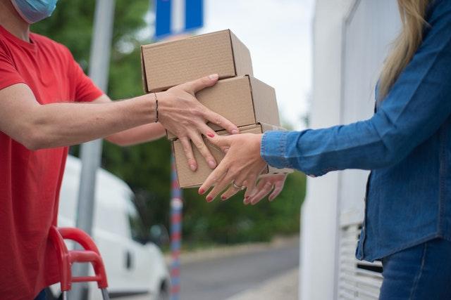 woman collecting her home delivery of package