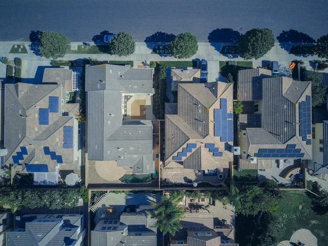 bird view of a modern community with solar panel on top