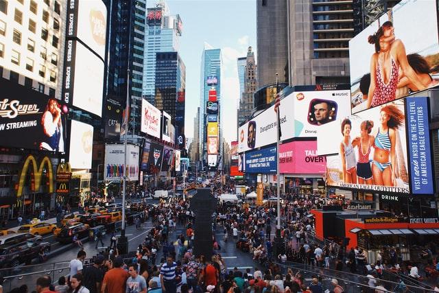 New York time square full of people and advertising screen