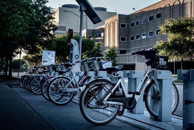 black and silver electric bike park in the sideway