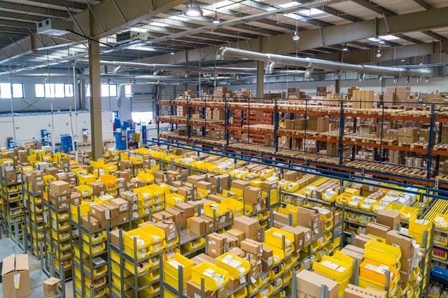 yellow shelve in a large fulfillment center