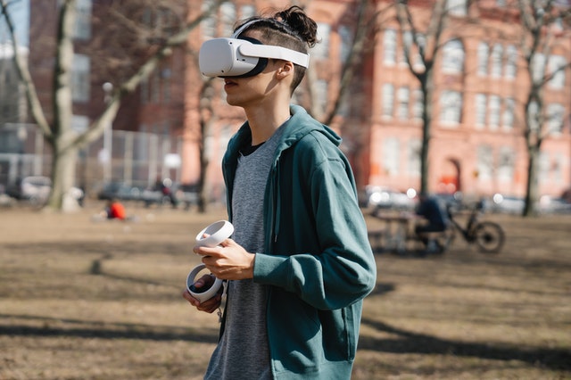 man walking with virtual reality headset in a park