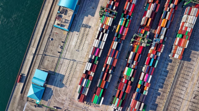 bird eye view of a port with a lot of containers