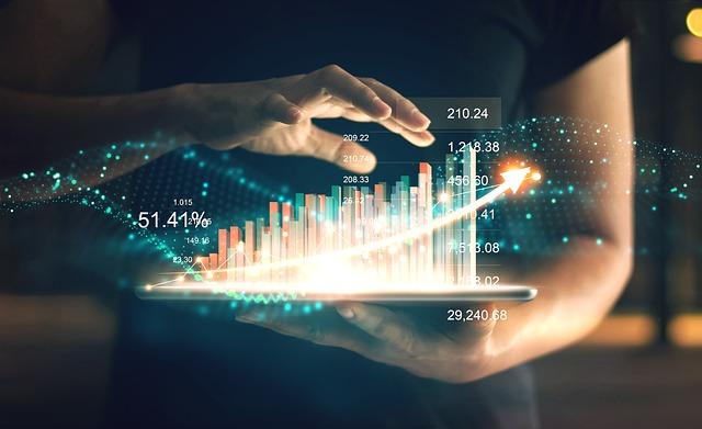 woman holding a tablet showing an exponential graph 